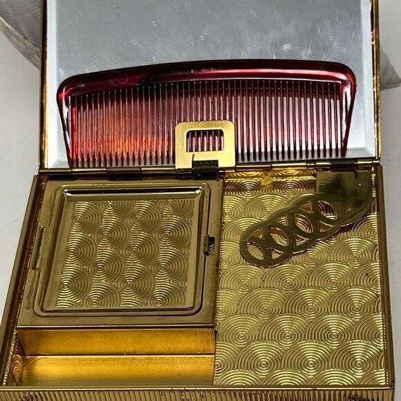 Vintage, gold tone compact/purse.  